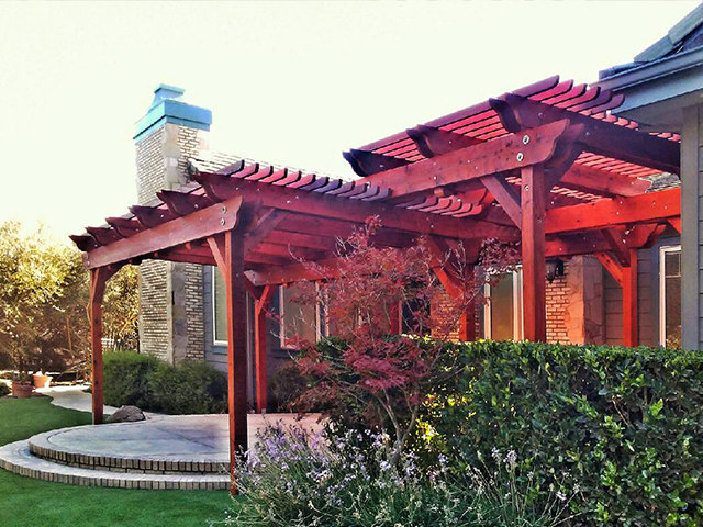 Garden arbor surrounded by established plants